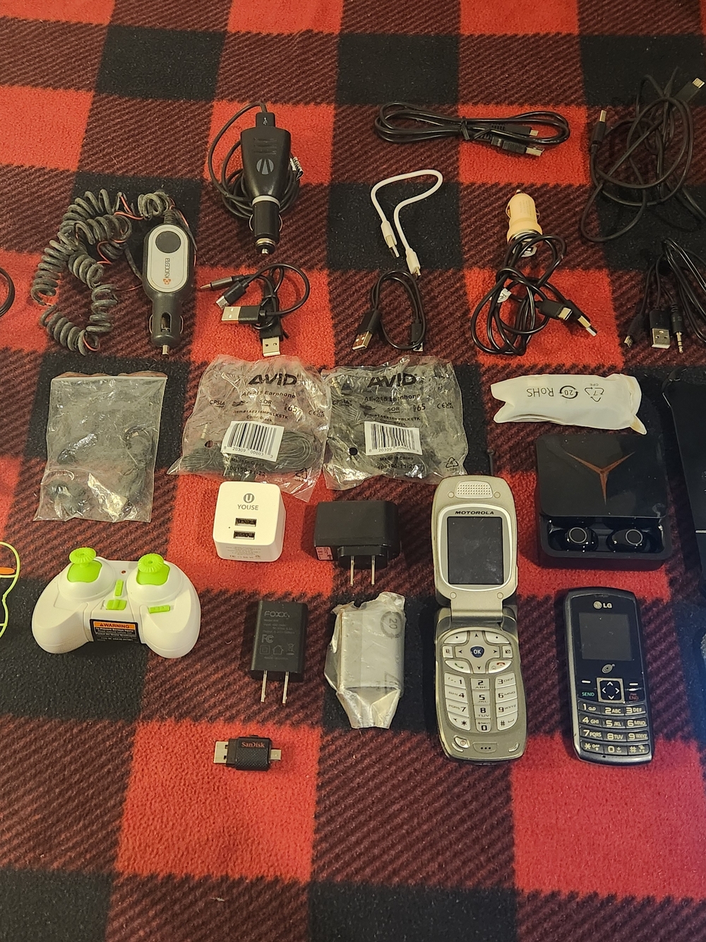 Elctronics Lot, Cellphones, Charging Cords, Remotes, And More